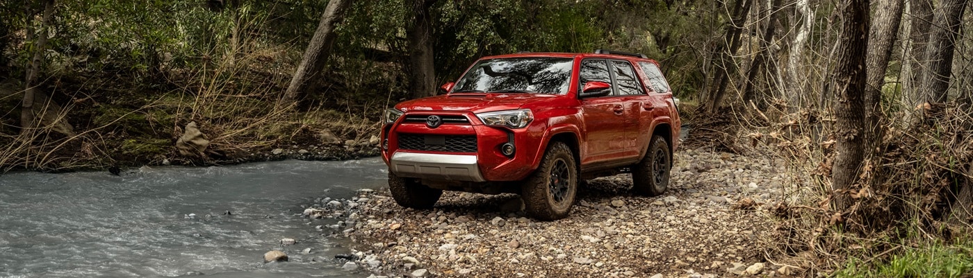 Red Toyota 4Runner
TRD Off Road Premium parked by a river