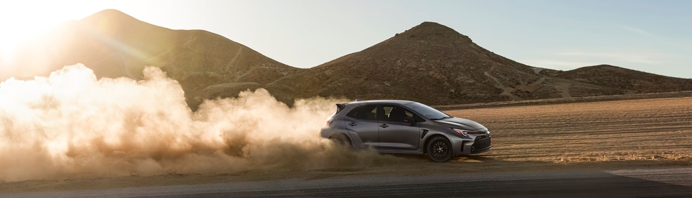 Grey Toyota GR Corolla driving in the
desert