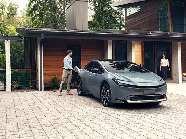 Toyota Prius XSE charging in front of a
house