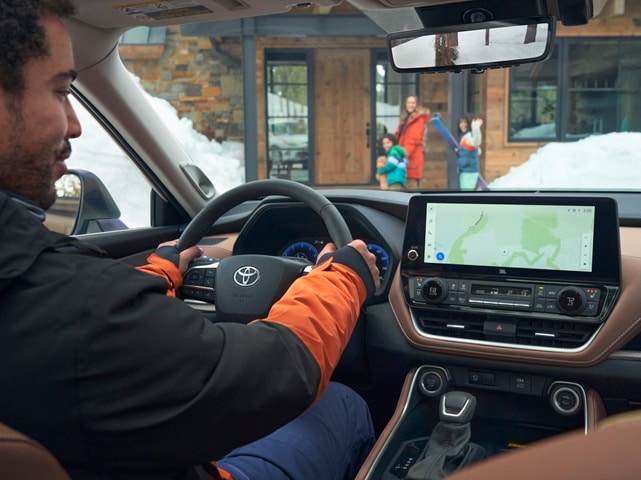 Person using a map screen of a Toyota Grand Highlander
