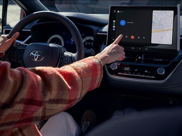 Person using the map console of a Corolla Hybrid