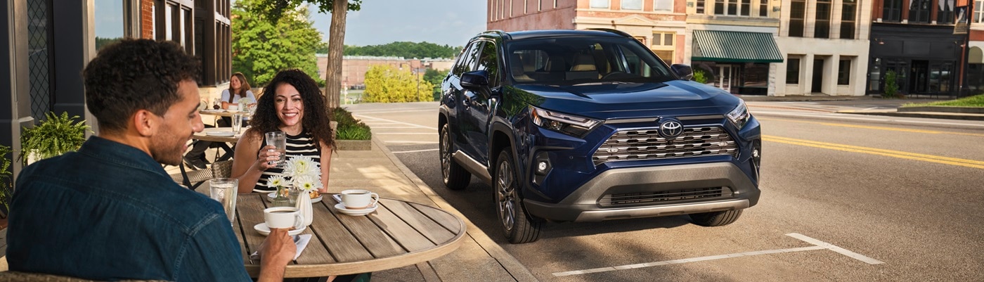 Blue Toyota RAV4
Limited parked in front of a cafe