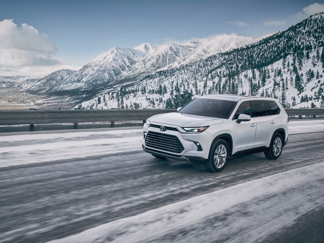 Grand Highlander Platinum driving thru the
snow