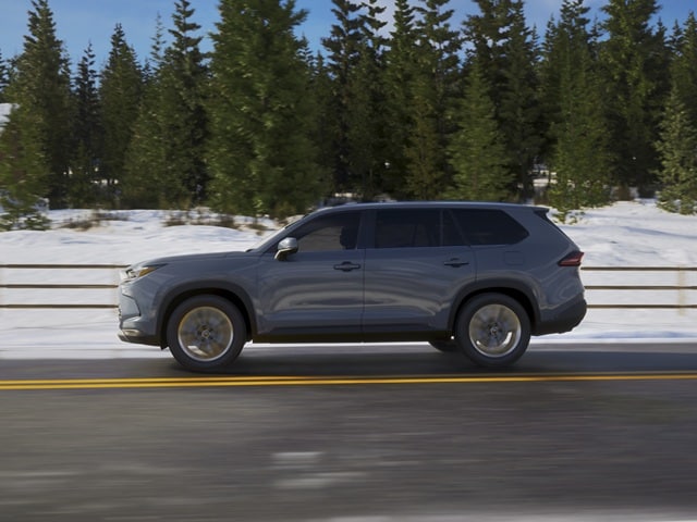Grand Highlander Hybrid driving on a snowy highway