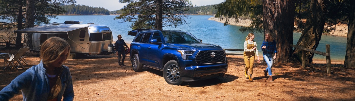 Blue Toyota Sequoia
Platinum parked at a lakeside camp