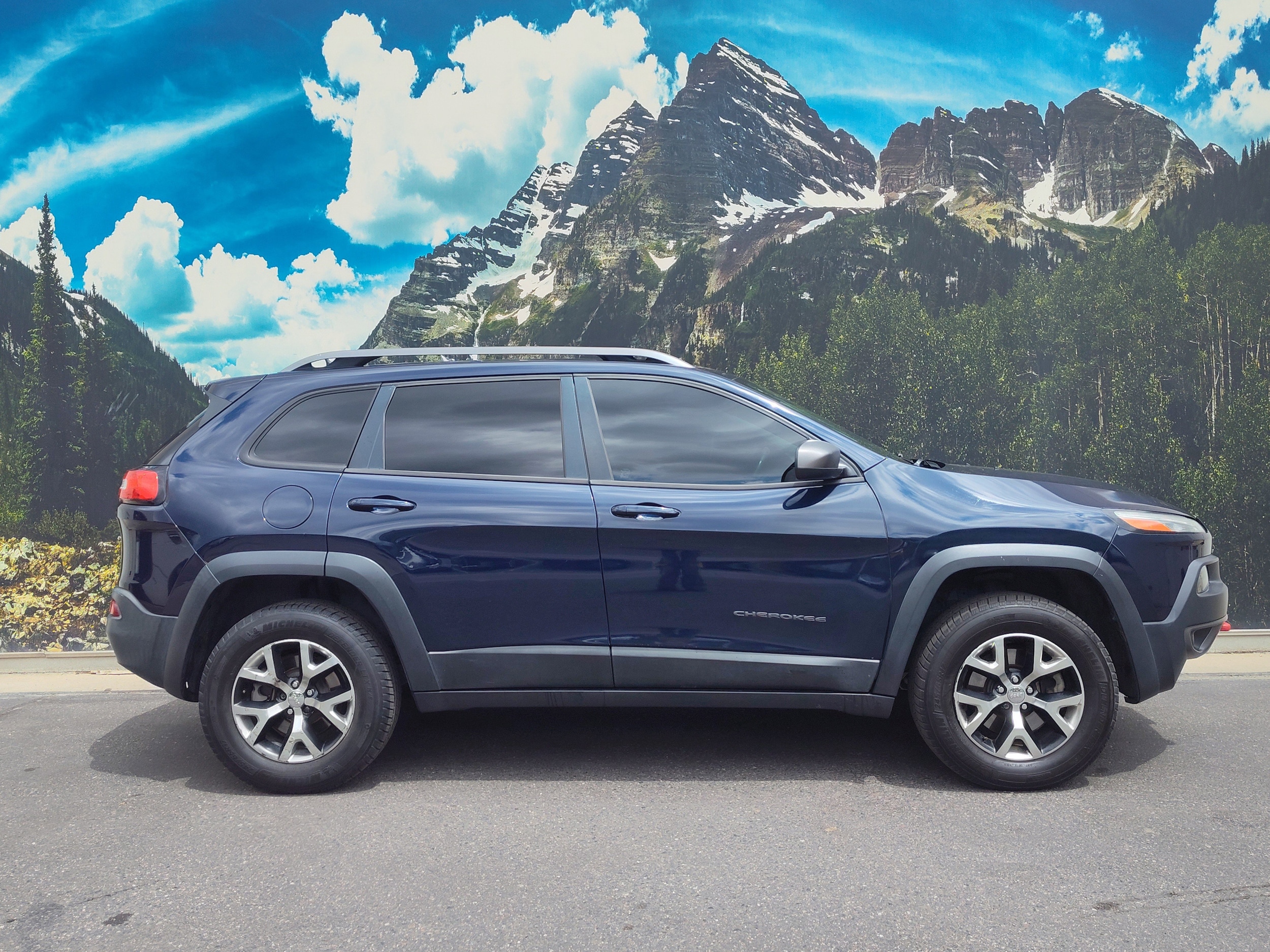 Used 2015 Jeep Cherokee Trailhawk with VIN 1C4PJMBS4FW564595 for sale in Denver, CO