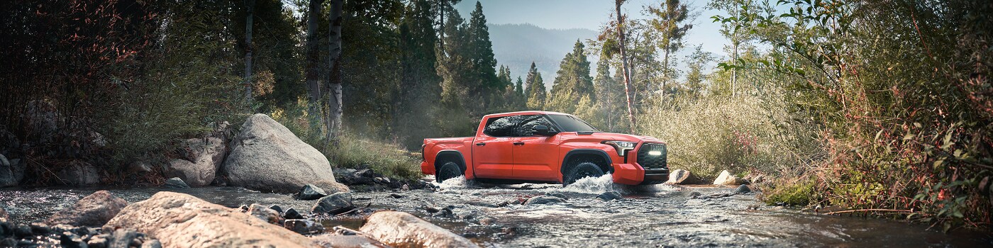 Toyota Tundra  i-Force MAX driving through a river