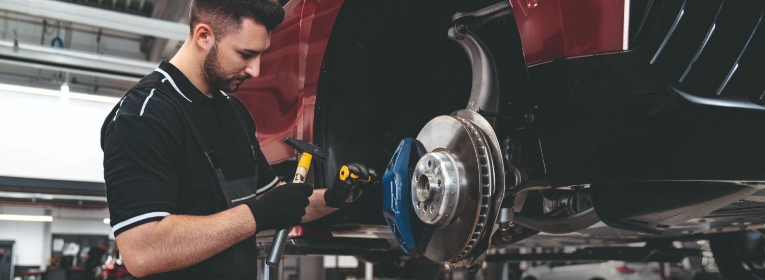 BMW service tech working on an electric vehicle