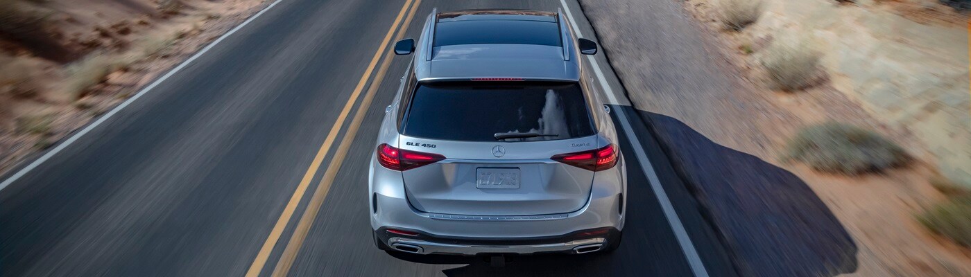 Mercedes-Benz GLE Silver Mercedes-Benz GLE 450 driving away in the desert