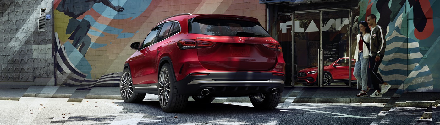Red Mercedes-Benz AMG GLA 35 parted in a city