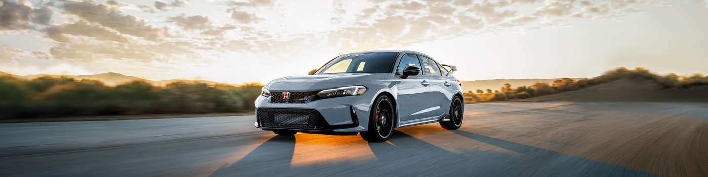 Honda Civic Type R White Civic Type R driving on a track in the desert