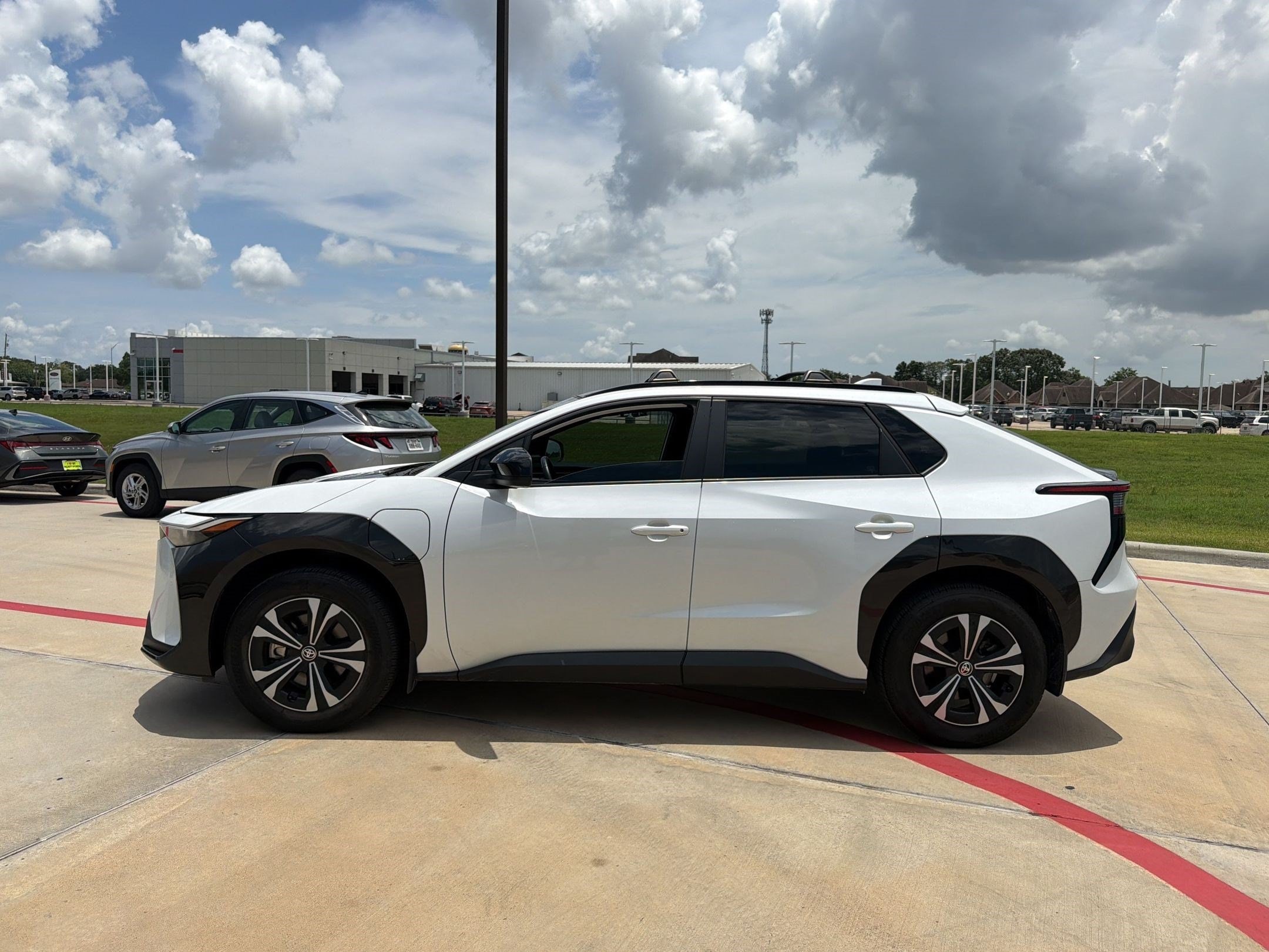 Used 2024 Toyota bZ4X XLE with VIN JTMAAAAA8RA036699 for sale in Nederland, TX