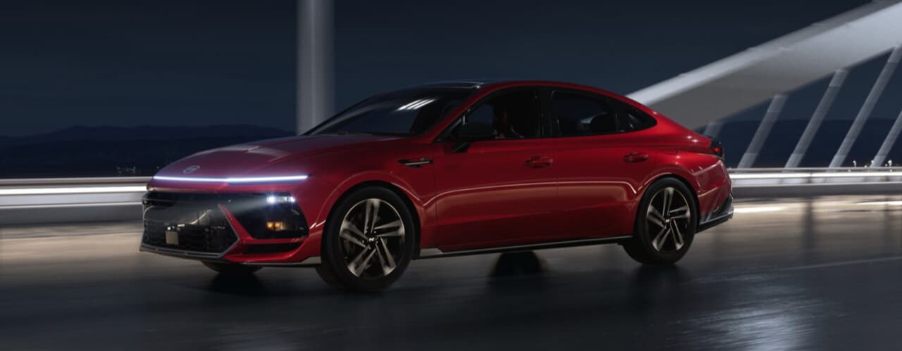 Exterior of Hyundai Sonata driving down a road