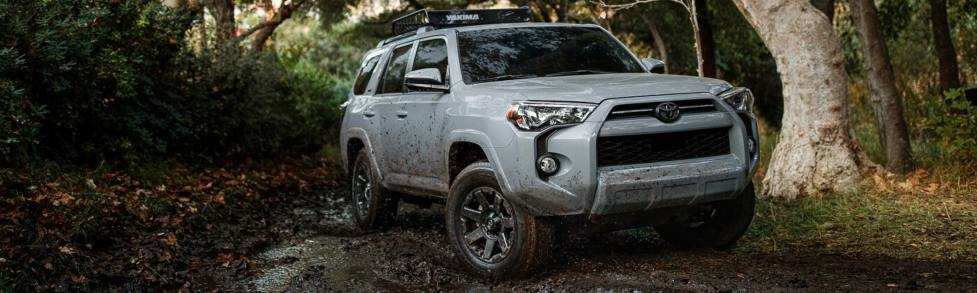 White Toyota 4Runner driving up a trail