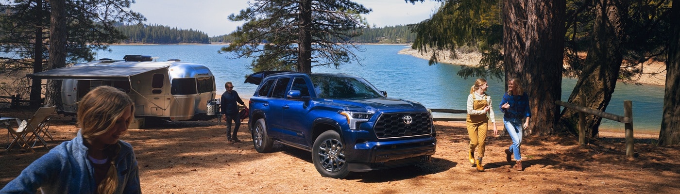 Blue Toyota Sequoia Platinum parked at a campsite