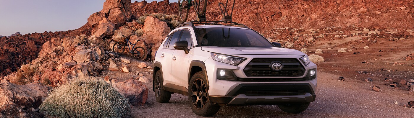 White Toyota RAV4 TRD Off Road parked in the desert
