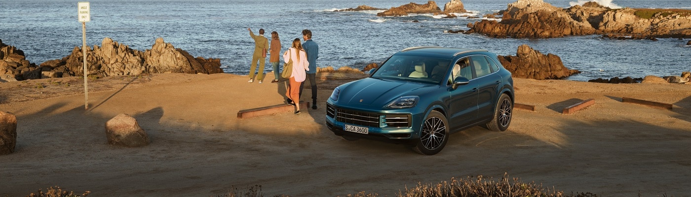 Cayenne parked near the ocean