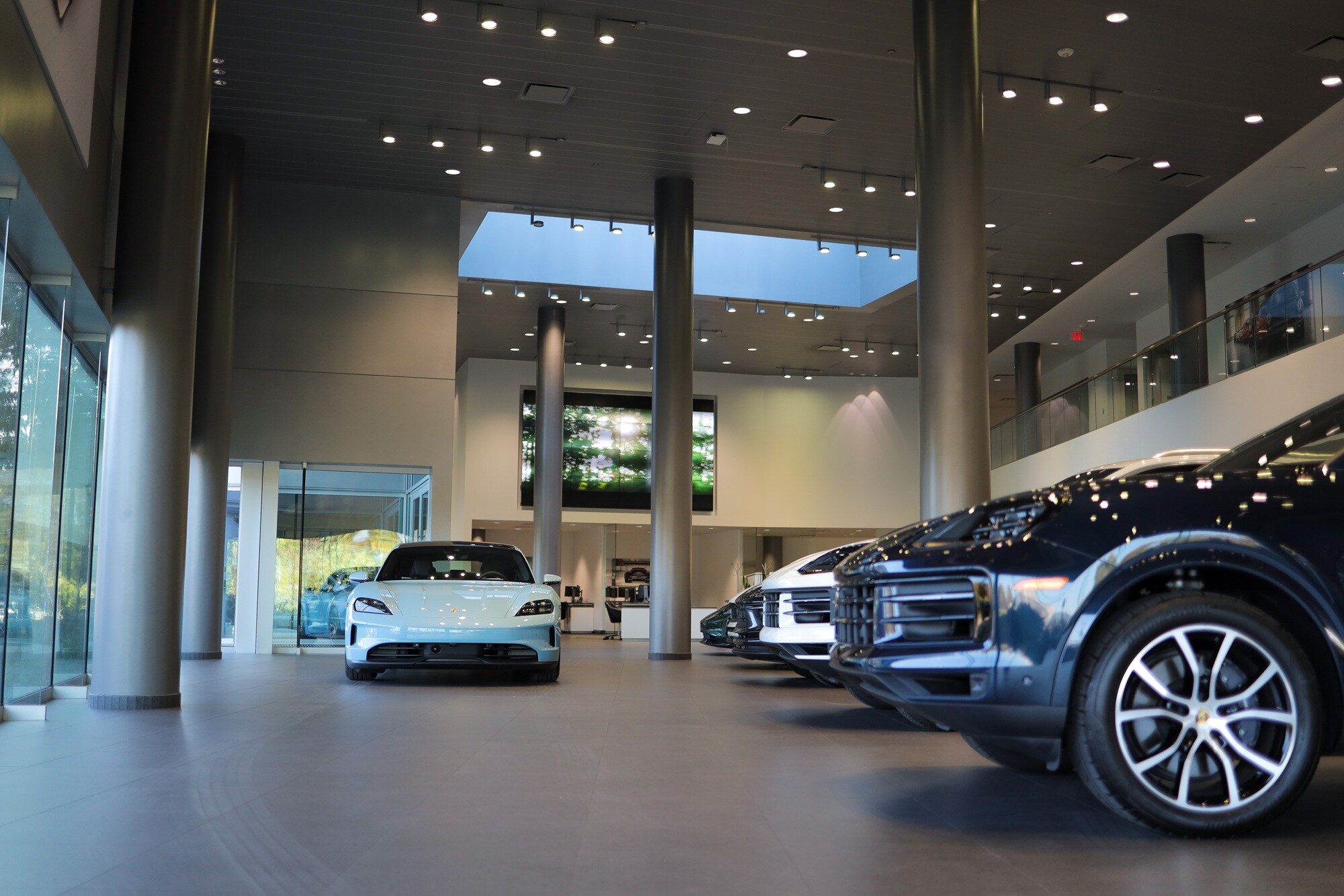 Porsche Bethesda Showroom Porsche Bethesda showroom with 5 vehicles under lighting