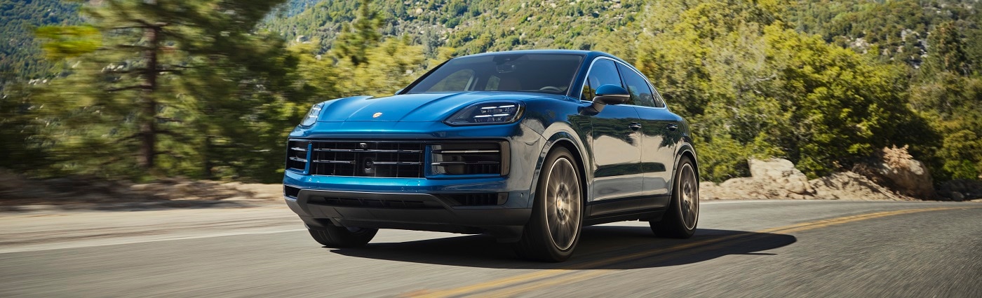 Porsche Cayenne Coupe Porsche Cayenne Coupe driving on a forest road