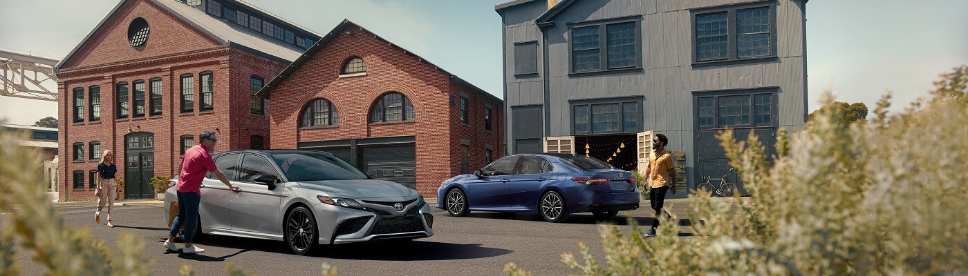 Toyota Sedan Models parked by some buildings
