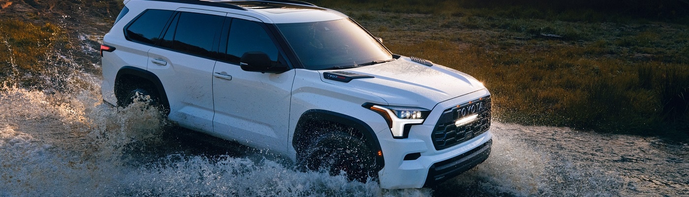 White Toyota Sequoia Capstone fording a river