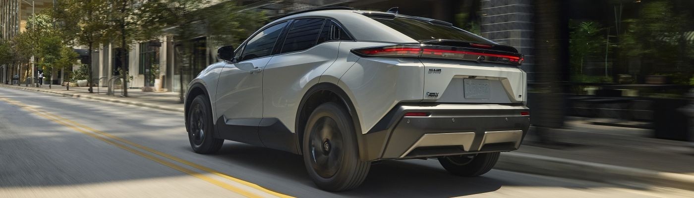 Toyota C-HR Toyota C-HR with Wind Chill Pearl Paint driving around the city
