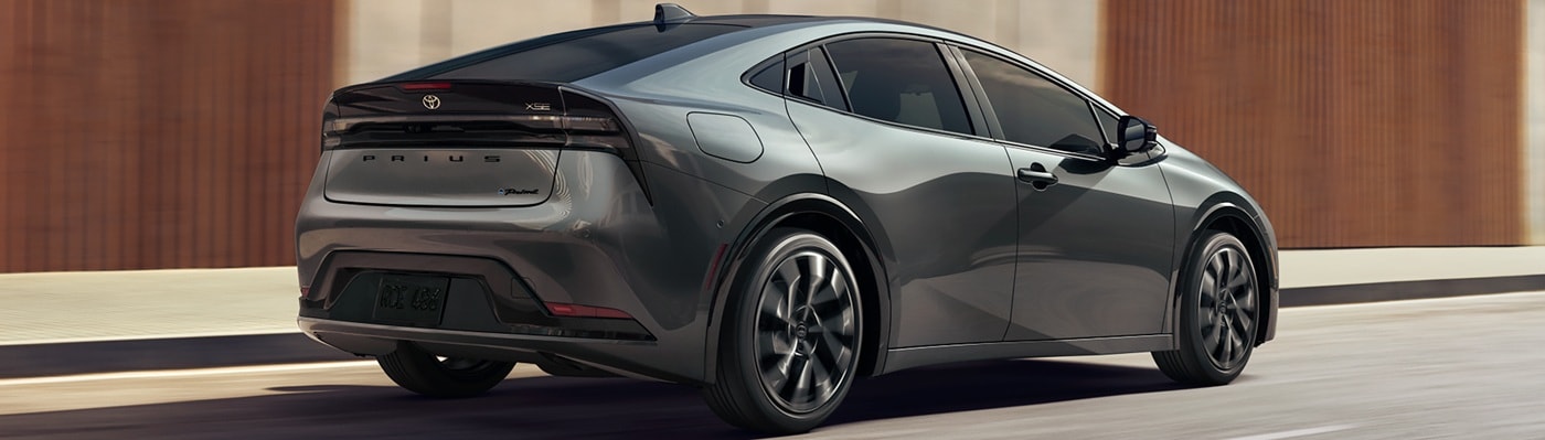 Grey Toyota Prius PHEV XSE driving on a city street