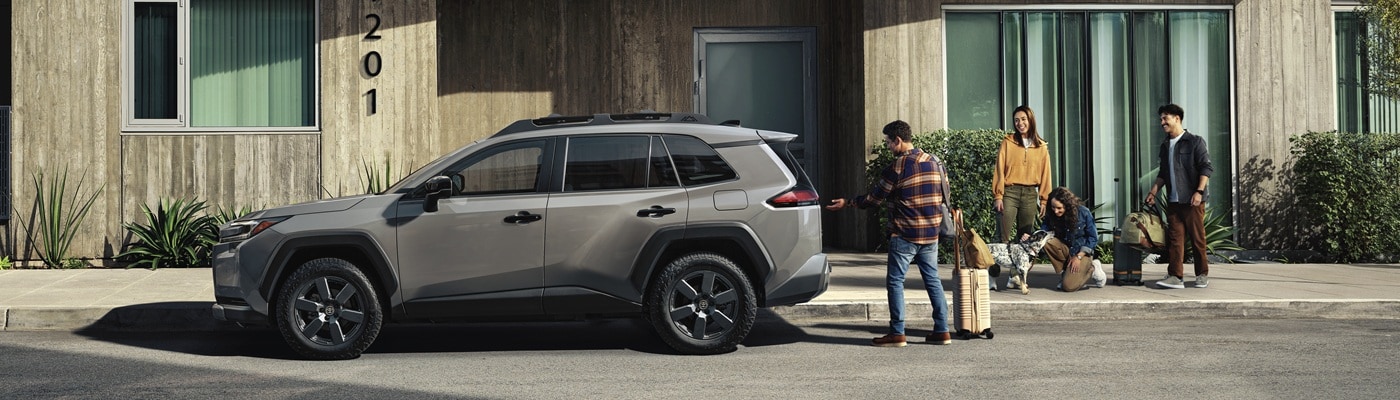 Grey Toyota RAV4 Limited parked in front of an apartment building
