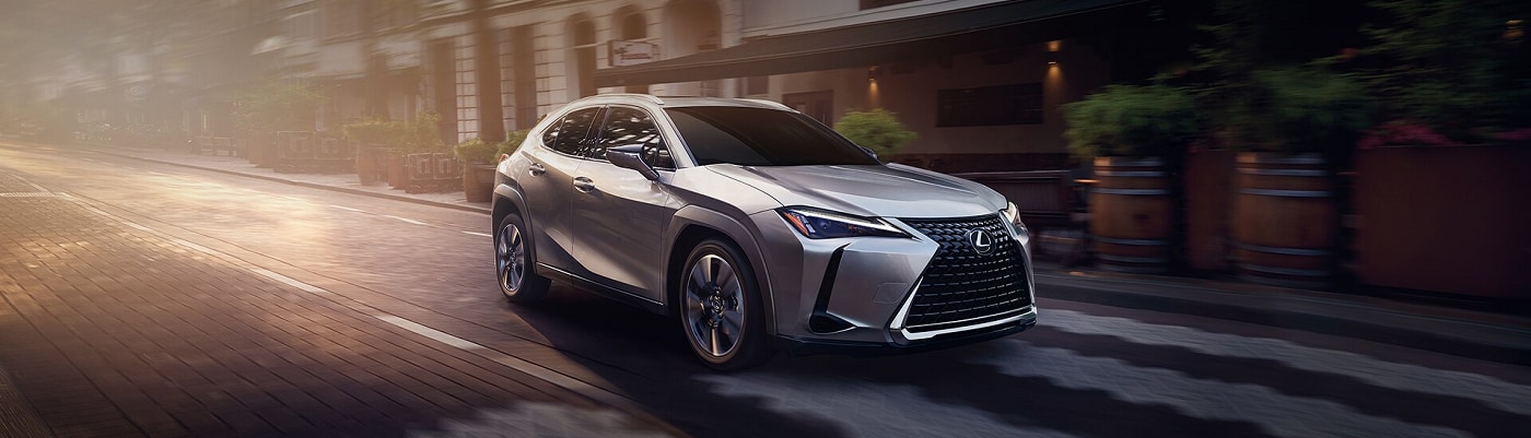 Lexus UX 250h driving down a city street