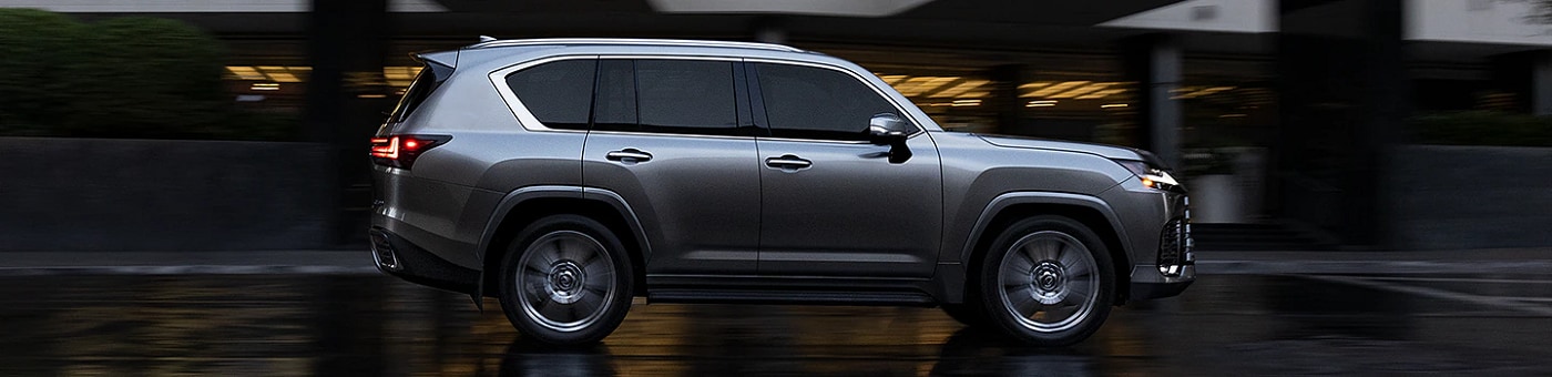 Grey Lexus LX 600 driving on a city street