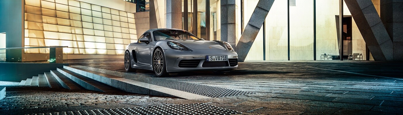 Grey Porsche 718 Cayman S parked in a city