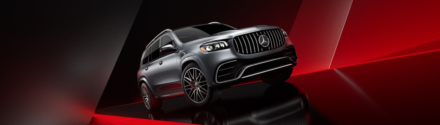 Silver Mercedes-Benz AMG GLS SUV parked in a red and black space