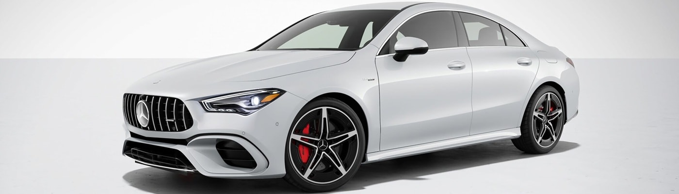 White Mercedes-Benz AMG CLA 45 S parked in a white space