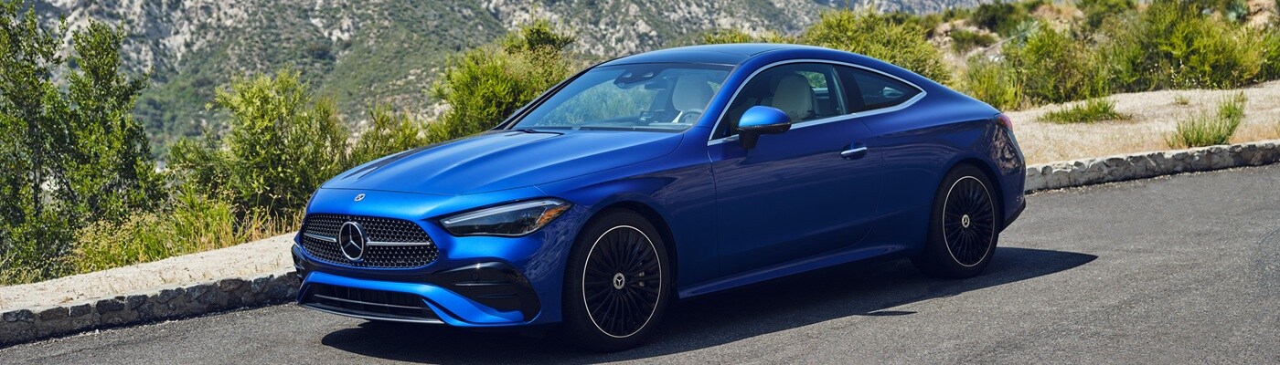Blue Mercedes-Benz CLE Coupe parked in the desert