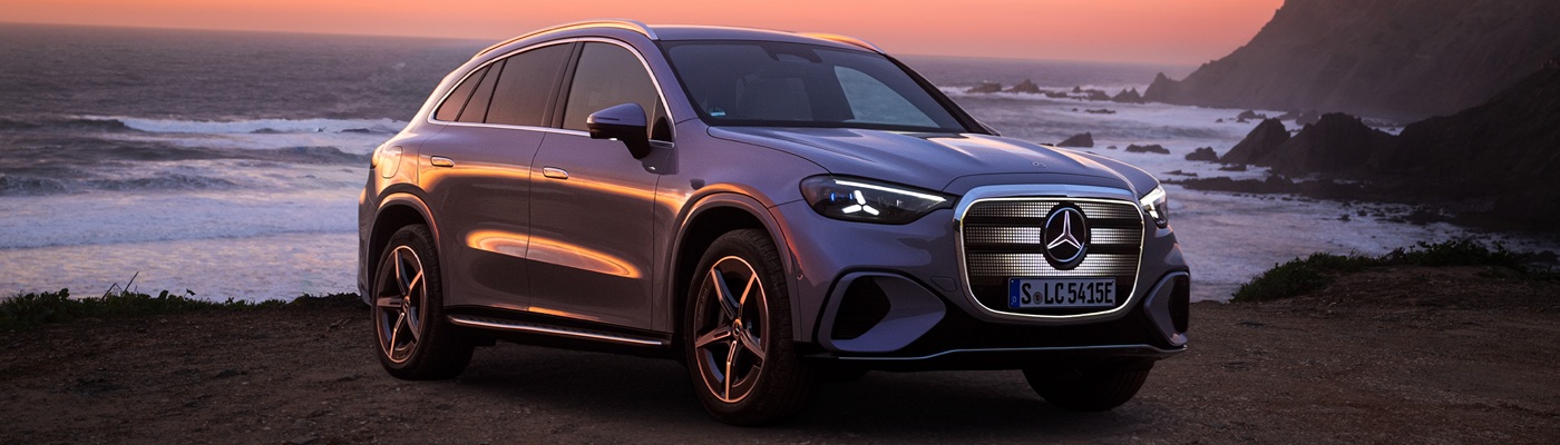 Grey Mercedes-Benz GLC Electric parked beside the ocean coast