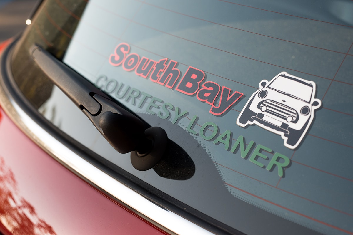 Complimentary Loaner Vehicles at South Bay MINI The rear window of a South Bay MINI service loaner vehicle.