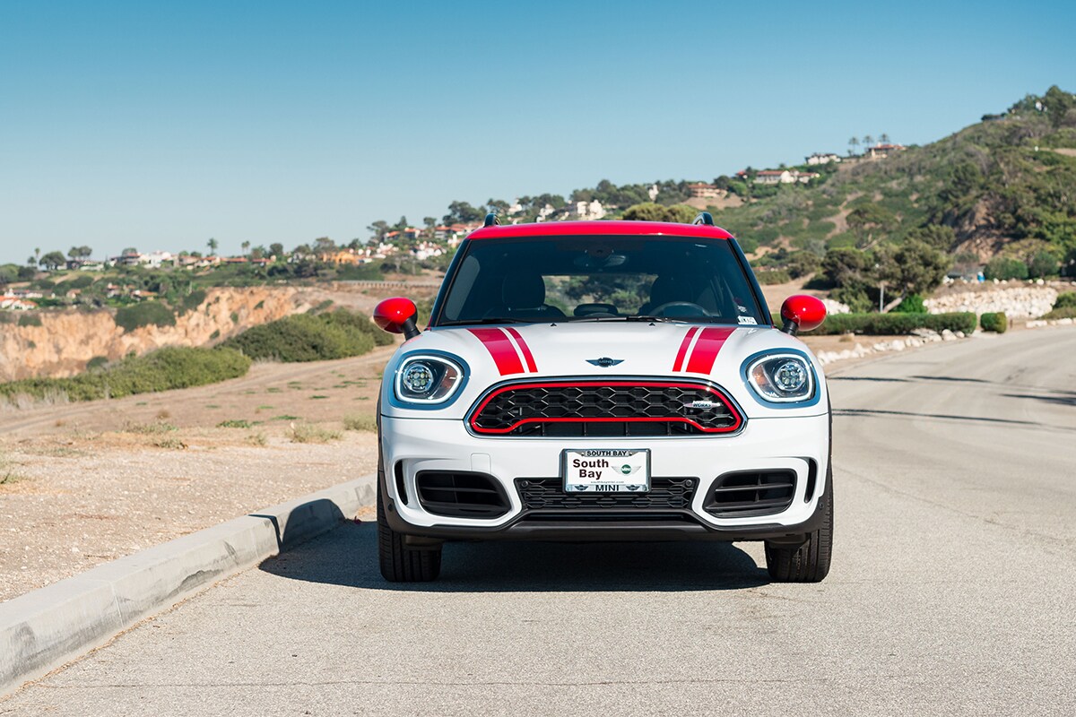 Sell/Trade In at South Bay MINI 2018 MINI Countryman John Cooper Works parked on a scenic road along the ocean.