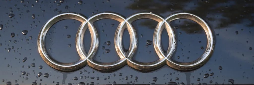 The Interesting Story Behind The Four Circled Symbol Of Audi Logo