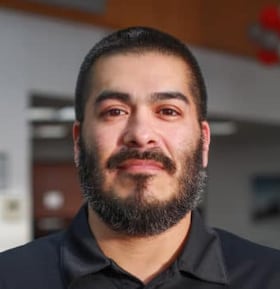 Staff member Andrew Perez from ID_d71b14fb3873