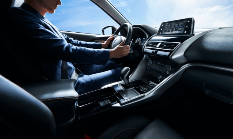 2020 Mitsubishi Eclipse Cross with a man sitting inside driving