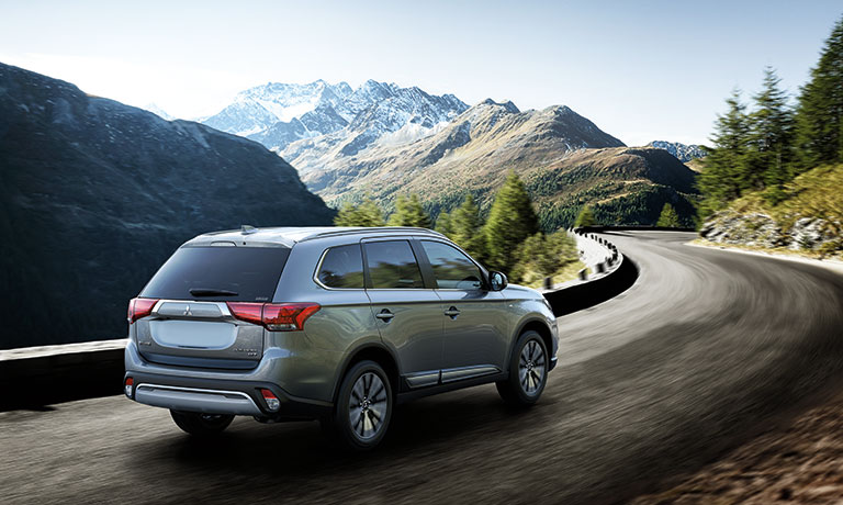2019 Mitsubishi Outlander driving on bridge