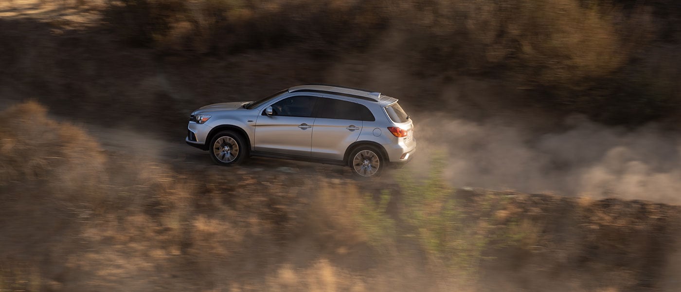 2019 Mitsubishi Outlander Sport driving through dirt road