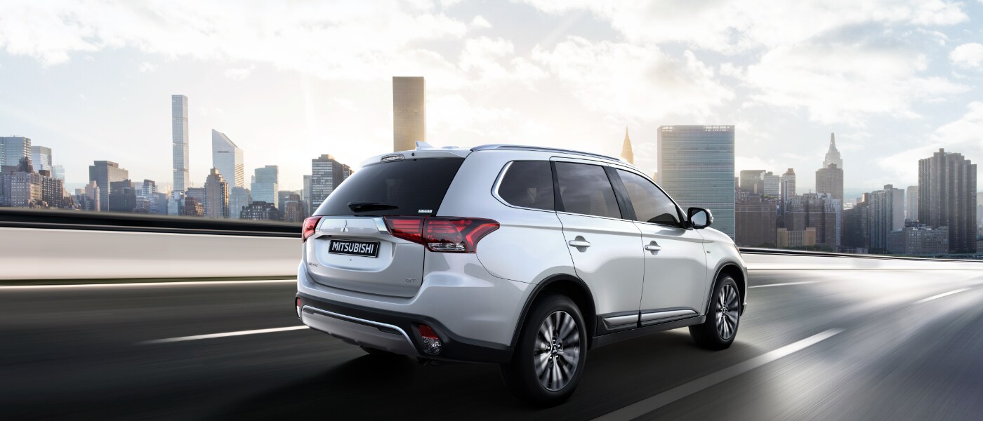2020 Mitsubishi Outlander driving towards city