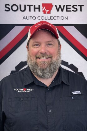 Staff member Brett Scroggins from a7a54963a70a