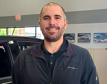 Staff member Logan West from ID_b68631