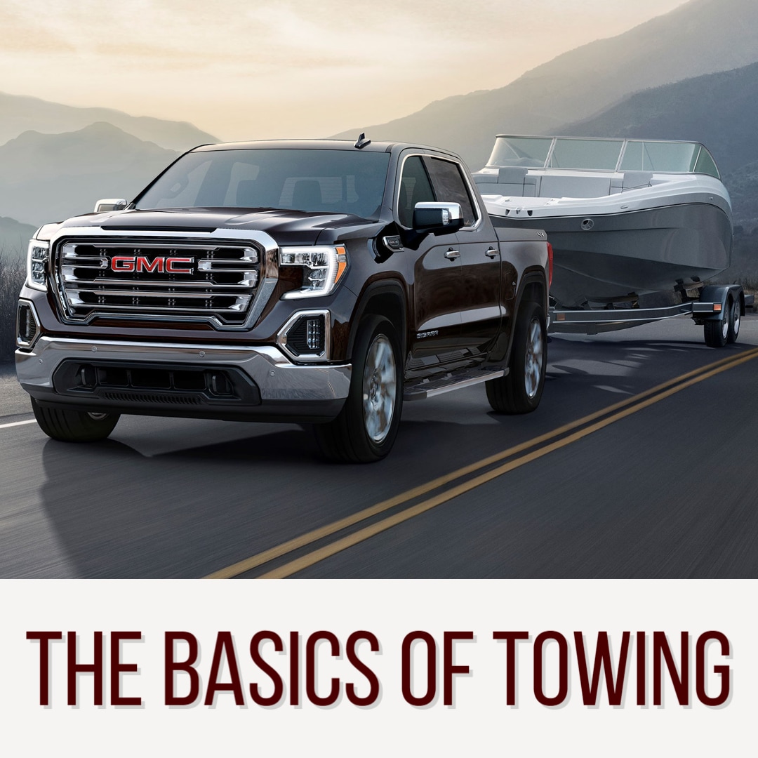 GMC Sierra Towing a boat above words: " The Basics of Towing"