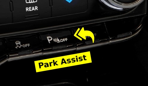 Close up of Park Assist Button with Yellow Arrows Pointing and Yellow "Park Assist" label