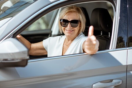 happy-woman-driving-car-blog.jpeg