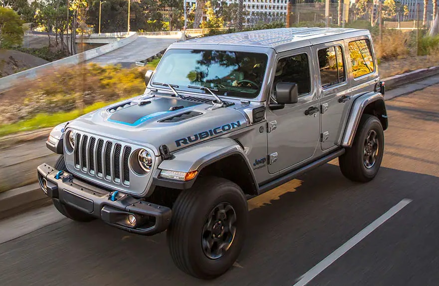 Front 3/4 View of Jeep Wrangler 4xe driving through city