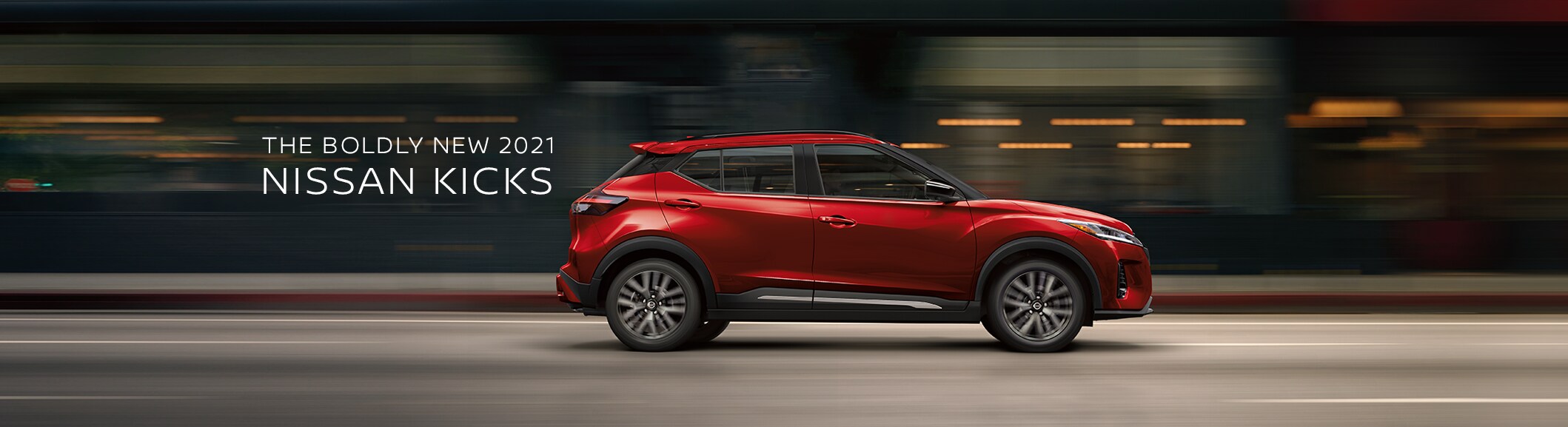 Side View of Red Nissan Kicks SUV in motion